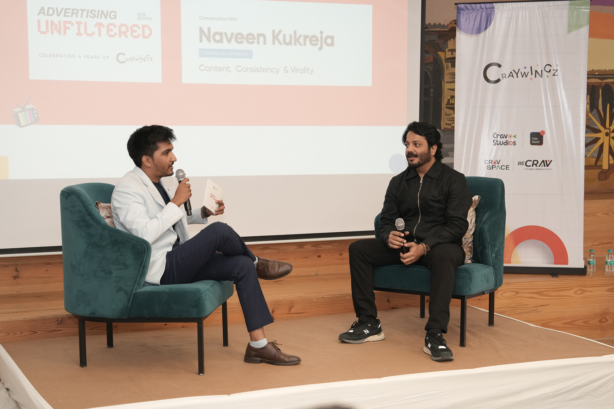 Host and speaker in conversation on stage