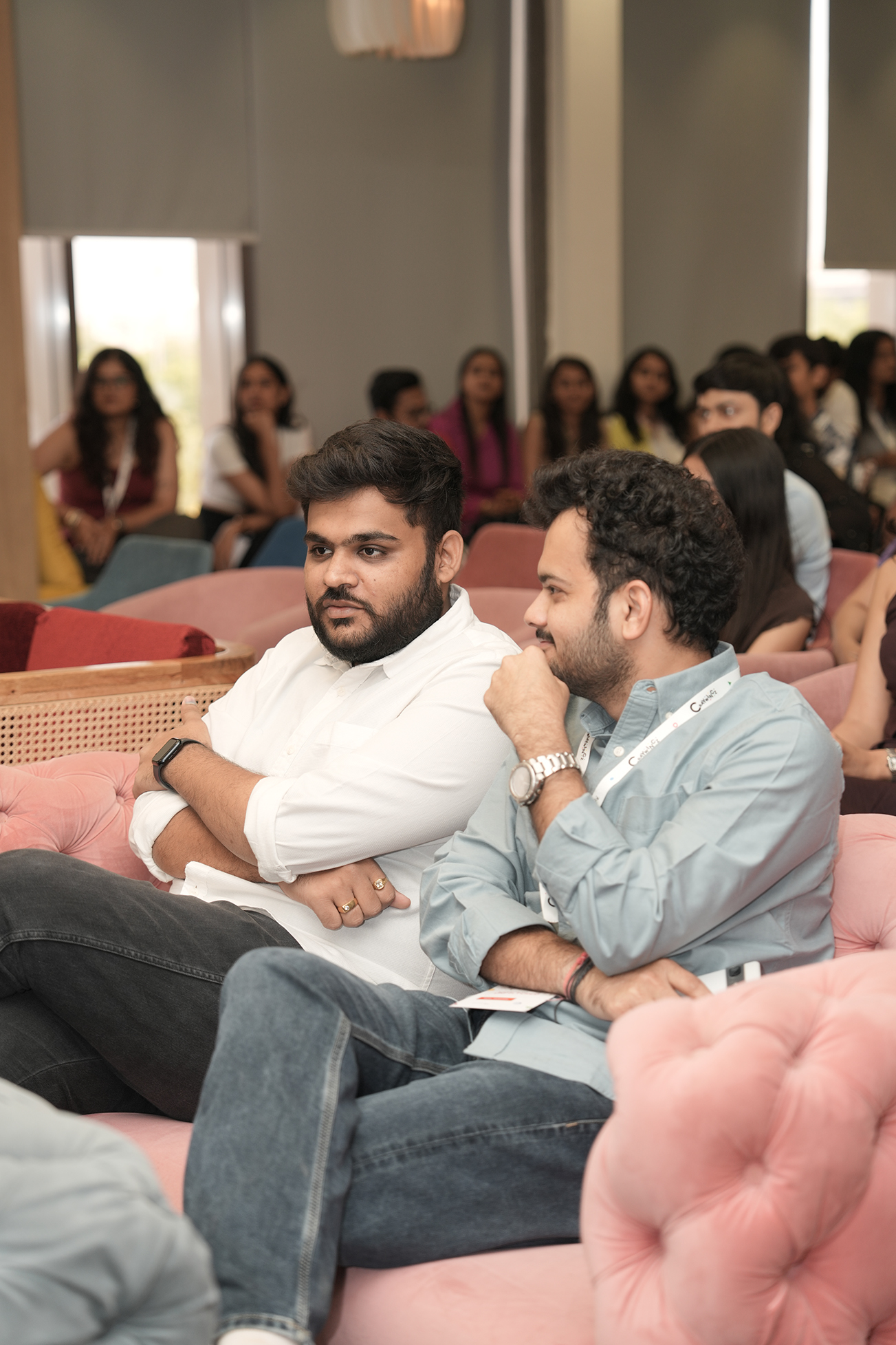 Two attendees listening