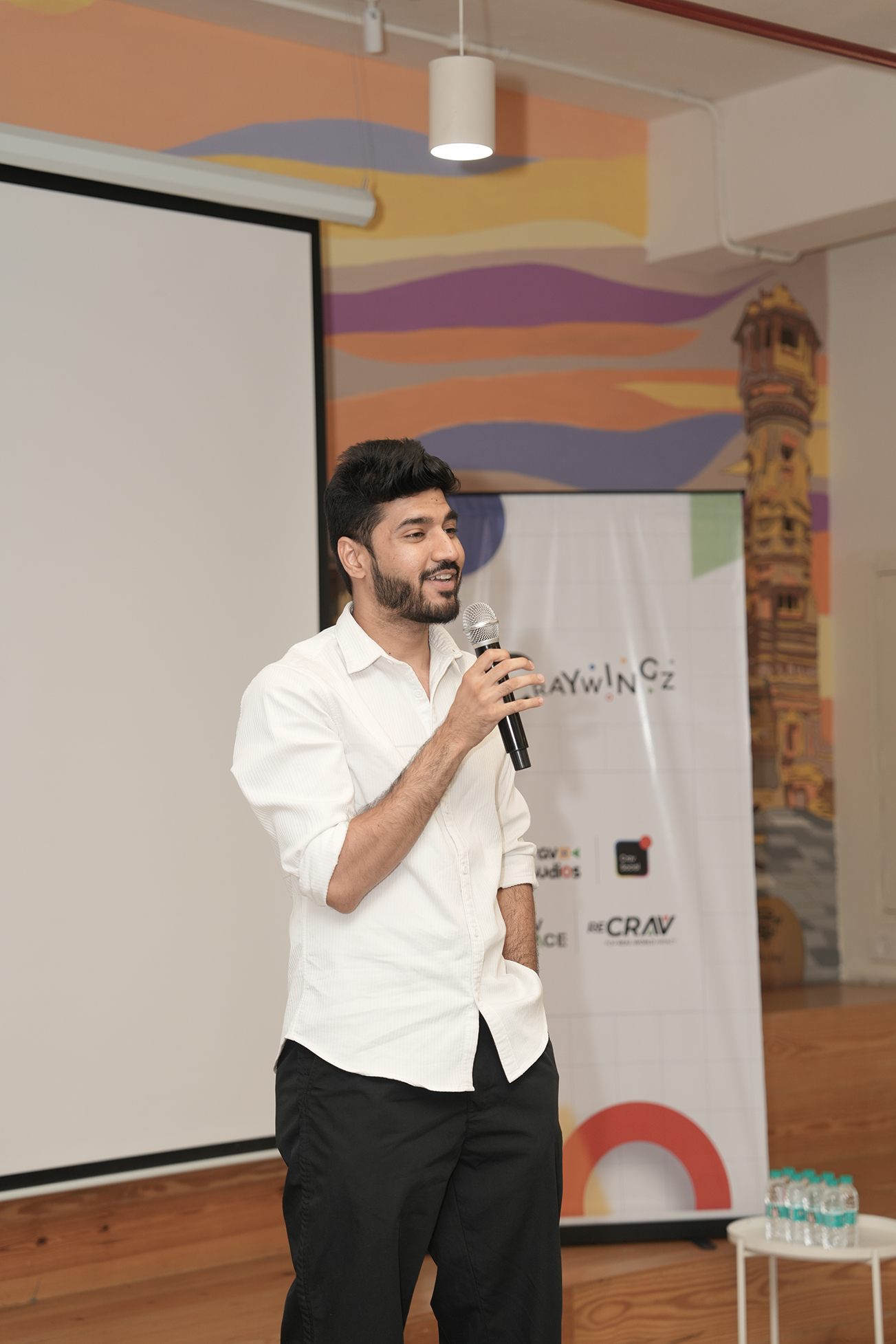 Speaker on stage with mic