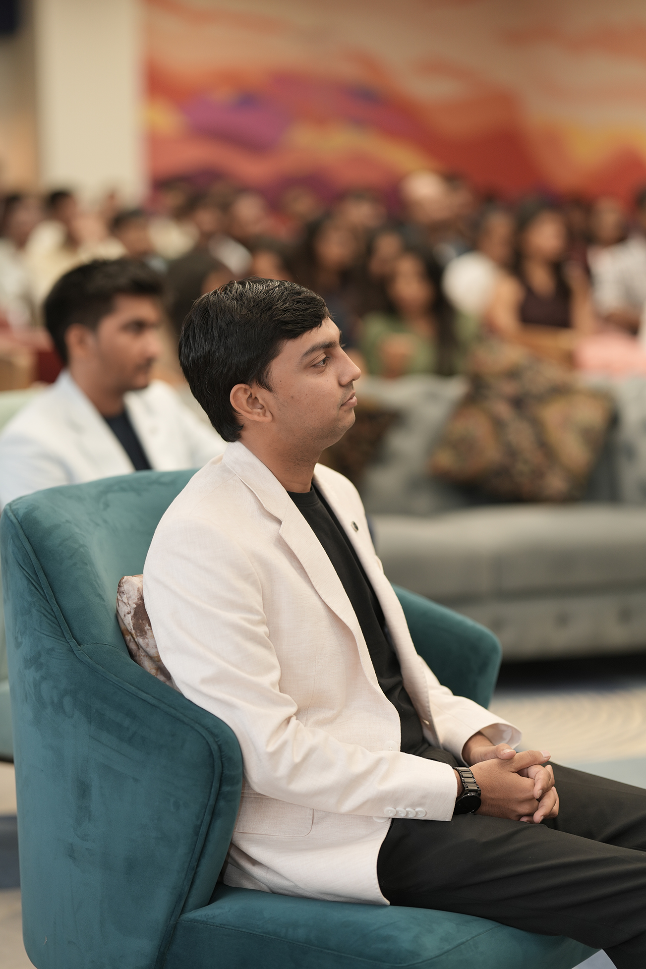 Attendee in white blazer